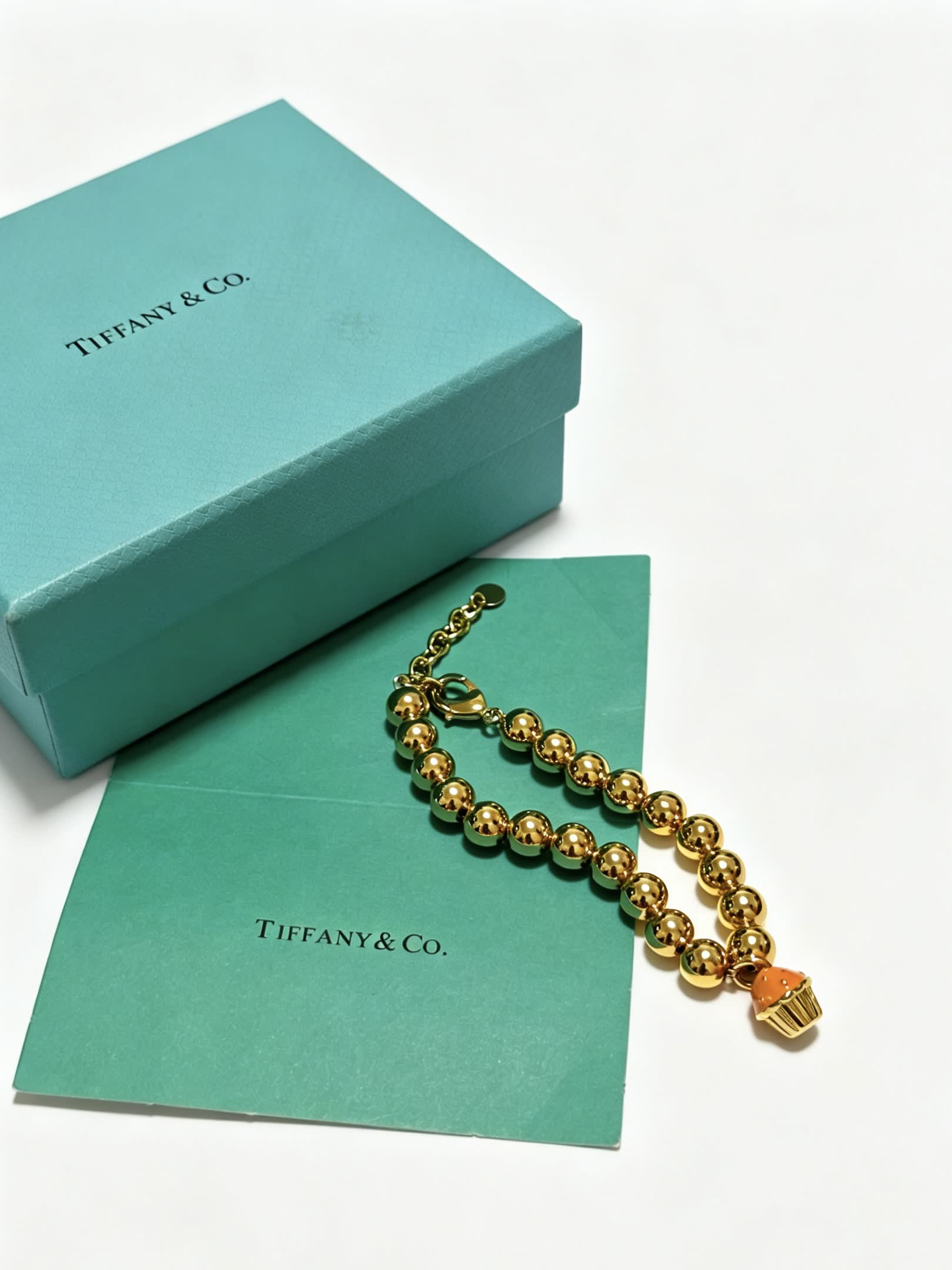 Tiffany & Co. Gold Bead Bracelet with Cupcake Charm Tiffany & Co. Gold Bead Bracelet with Cupcake Charm